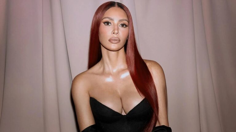 Kim Kardashian, 44, goes braless in revealing black frock to promote her new skincare range