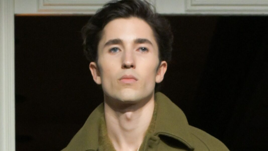 Nepo-baby with Oscar-winner dad and movie star mum models at fashion show – can you guess who his famous parents are?