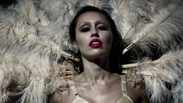 Miley Cyrus goes completely topless in just a skirt for showgirl-themed CR Fashion Book cover