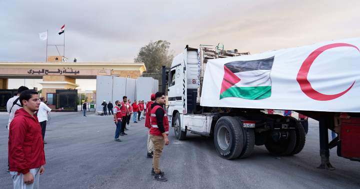 Aid trucks roll into Gaza as Israel-Hamas ceasefire takes hold – National