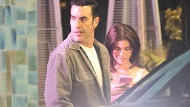Ali G star Sacha Baron Cohen, 54, cosies up to Kylie Jenner lookalike influencer 28 years his junior at Hollywood club