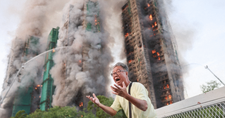 Fire in Hong Kong high-rise complex kills at least 13 with others trapped inside