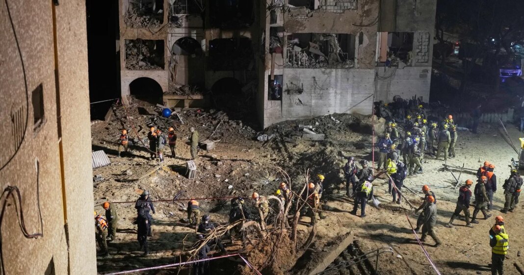 2 Iranian strikes on towns near Israel’s main nuclear research center injure more than 100 people