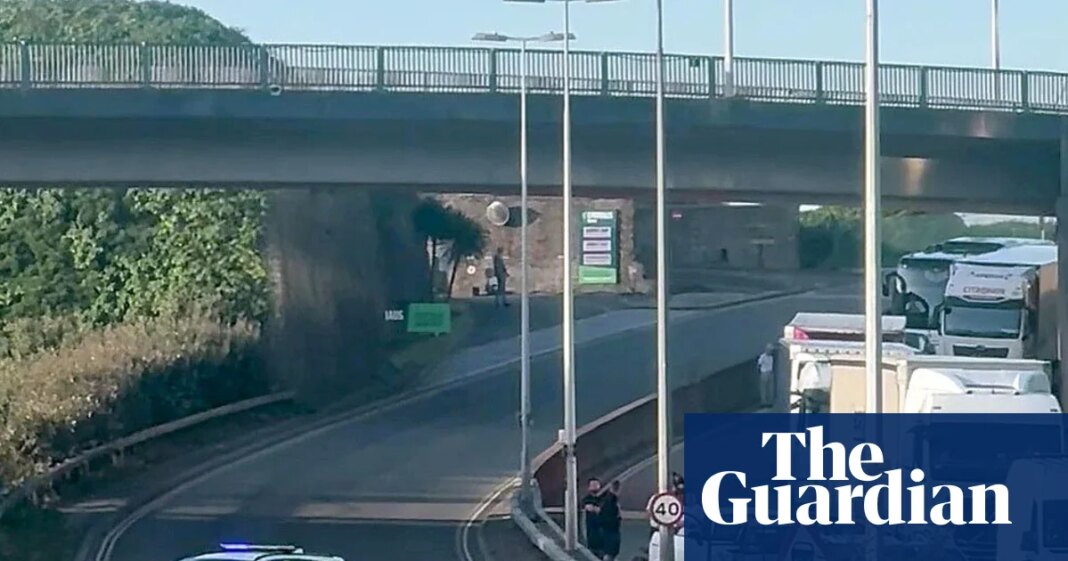 Black-clad protesters in balaclavas block road at port of Dover in Kent | Kent